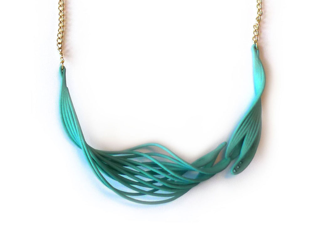 A necklace made out of waving and twisted lines.   